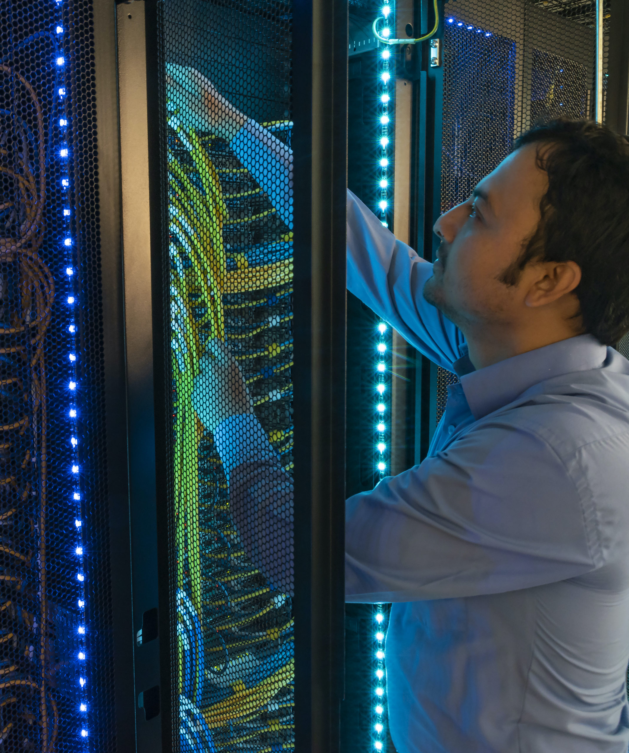 Man working on computer server wires in cybersecurity