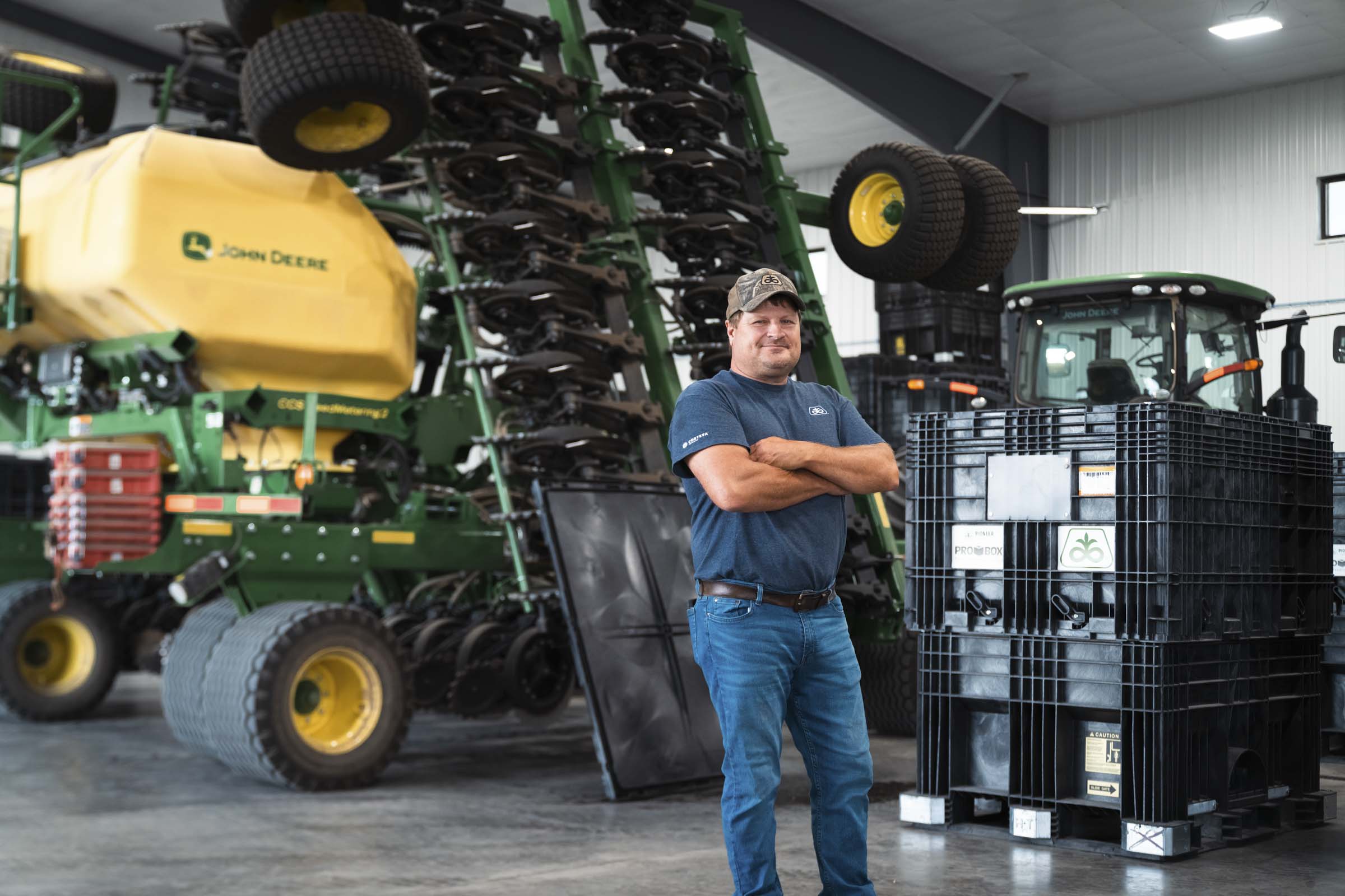 Man standing in front of tractors.
