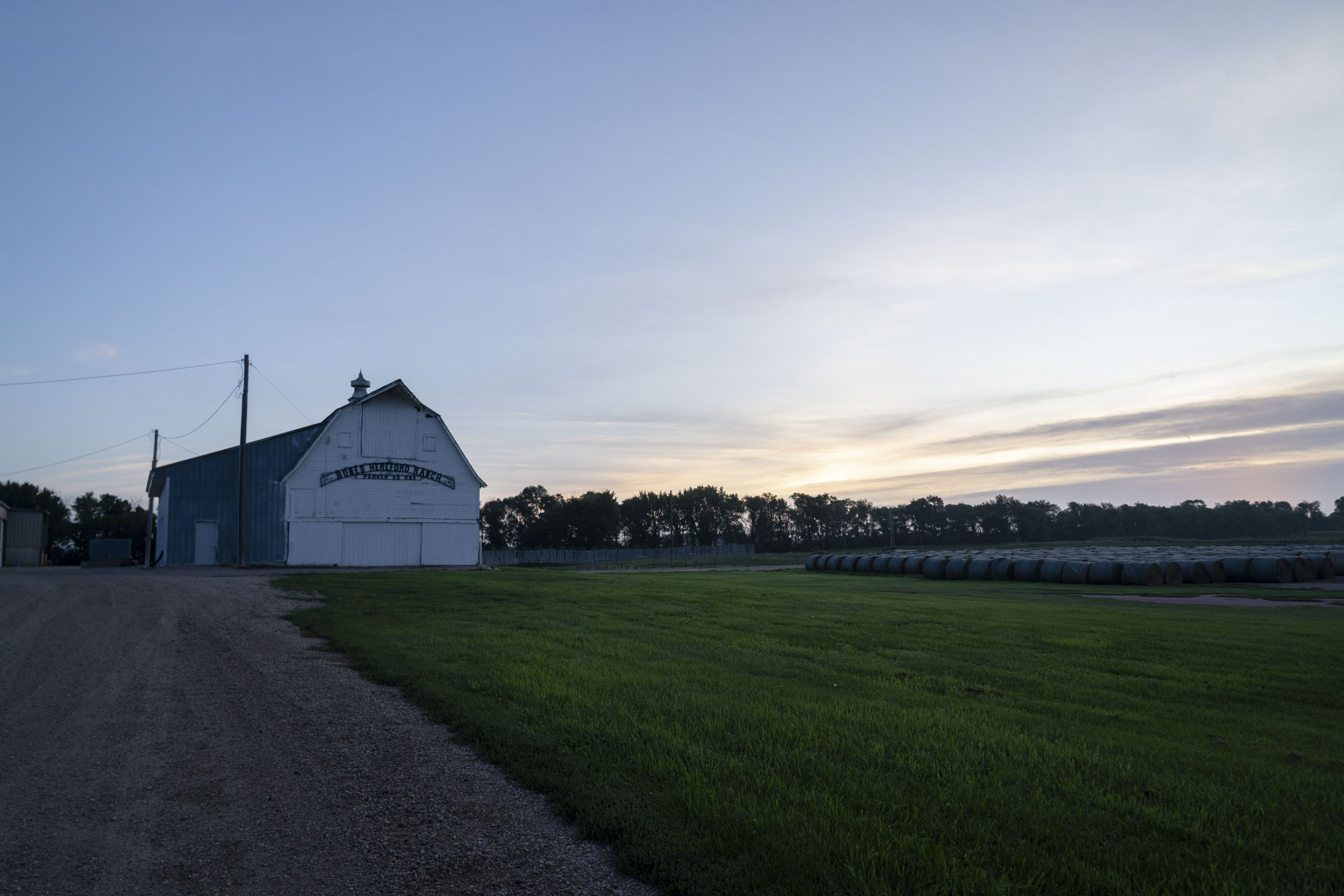 Barn in field at dusk.