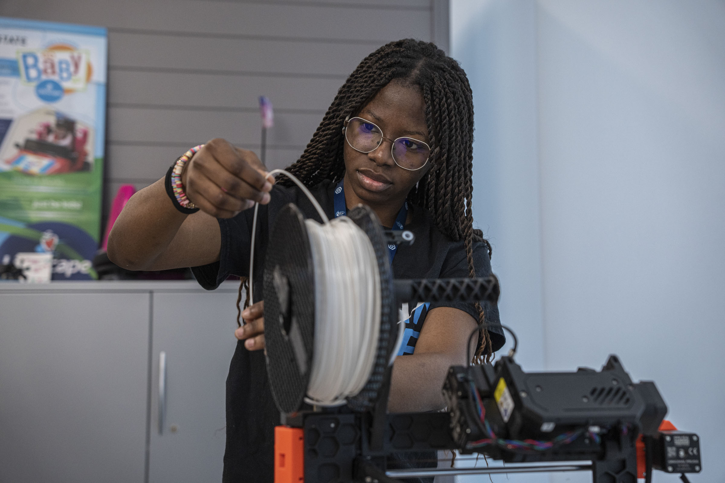 Woman working with electrical cord.