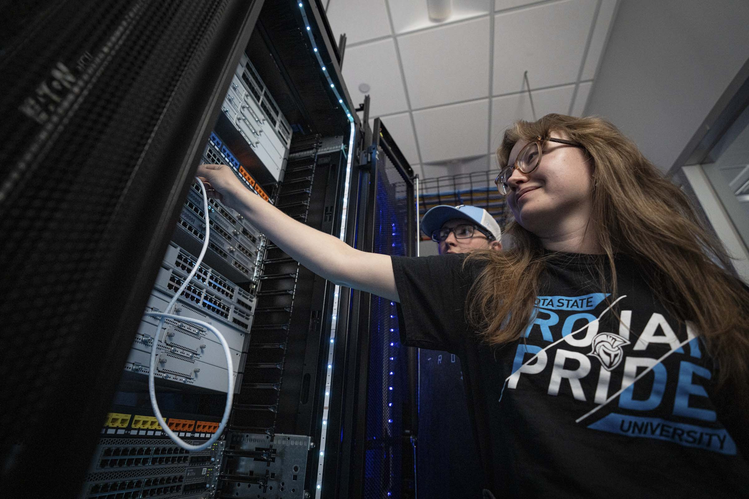 Student working on a computer server.