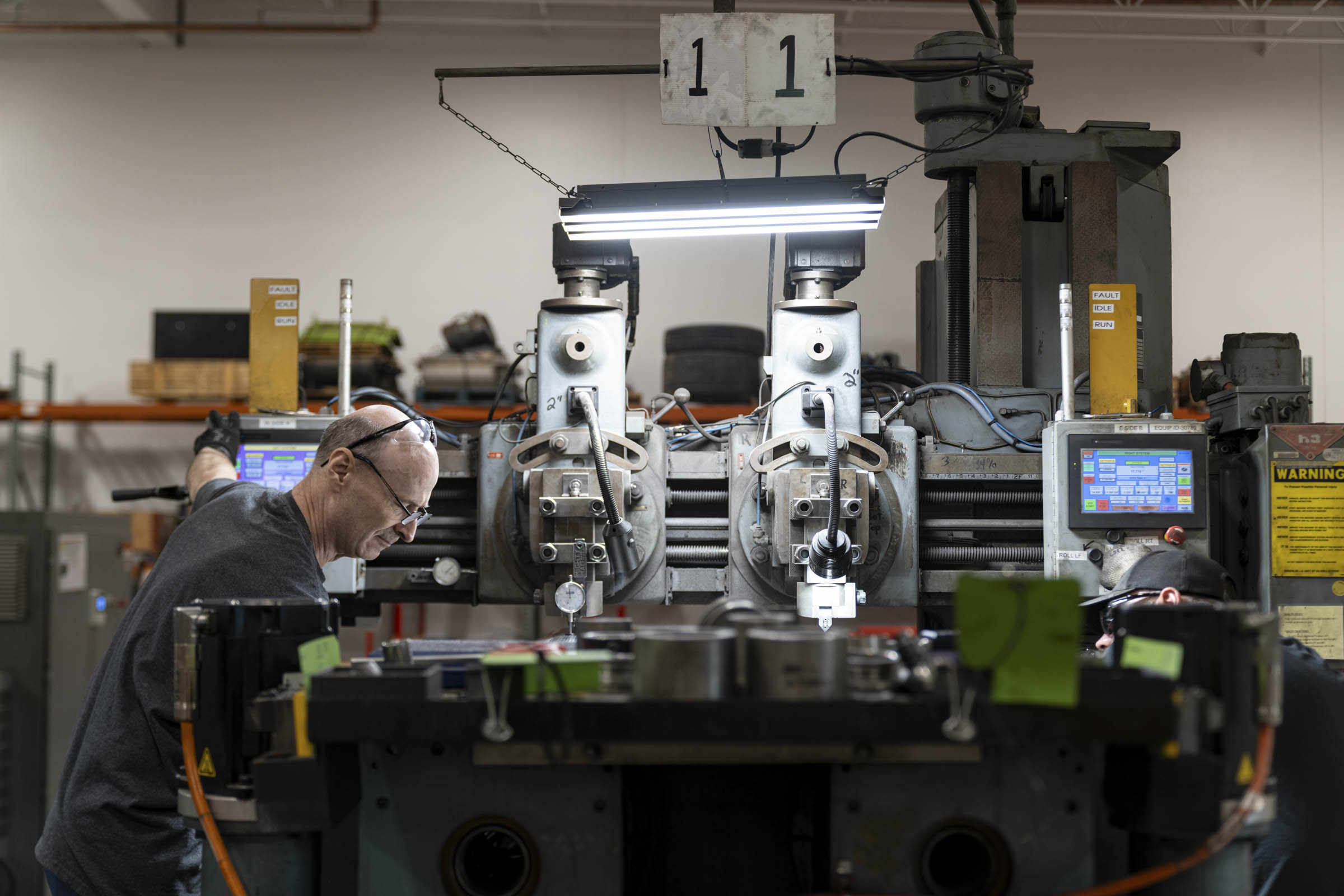 Man working in manufacturing facility.