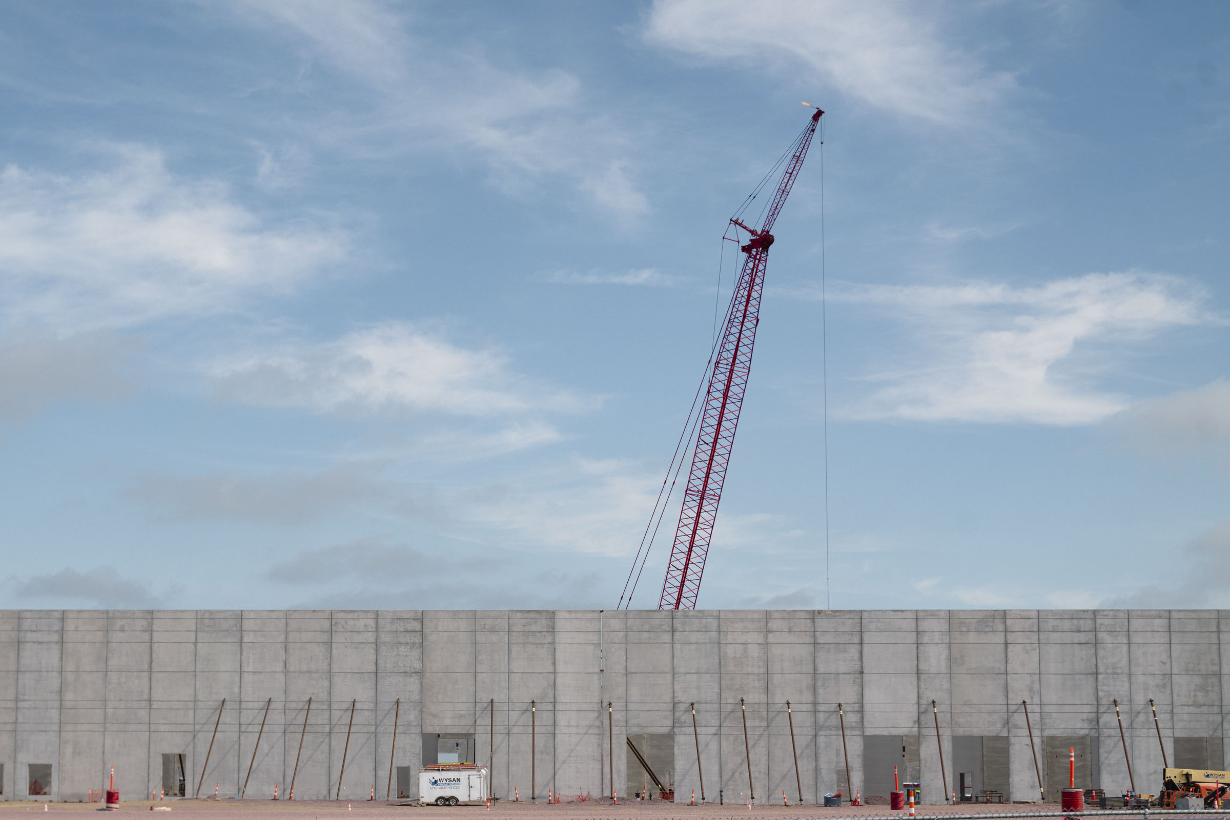 Cranes outside manufacturing facility.