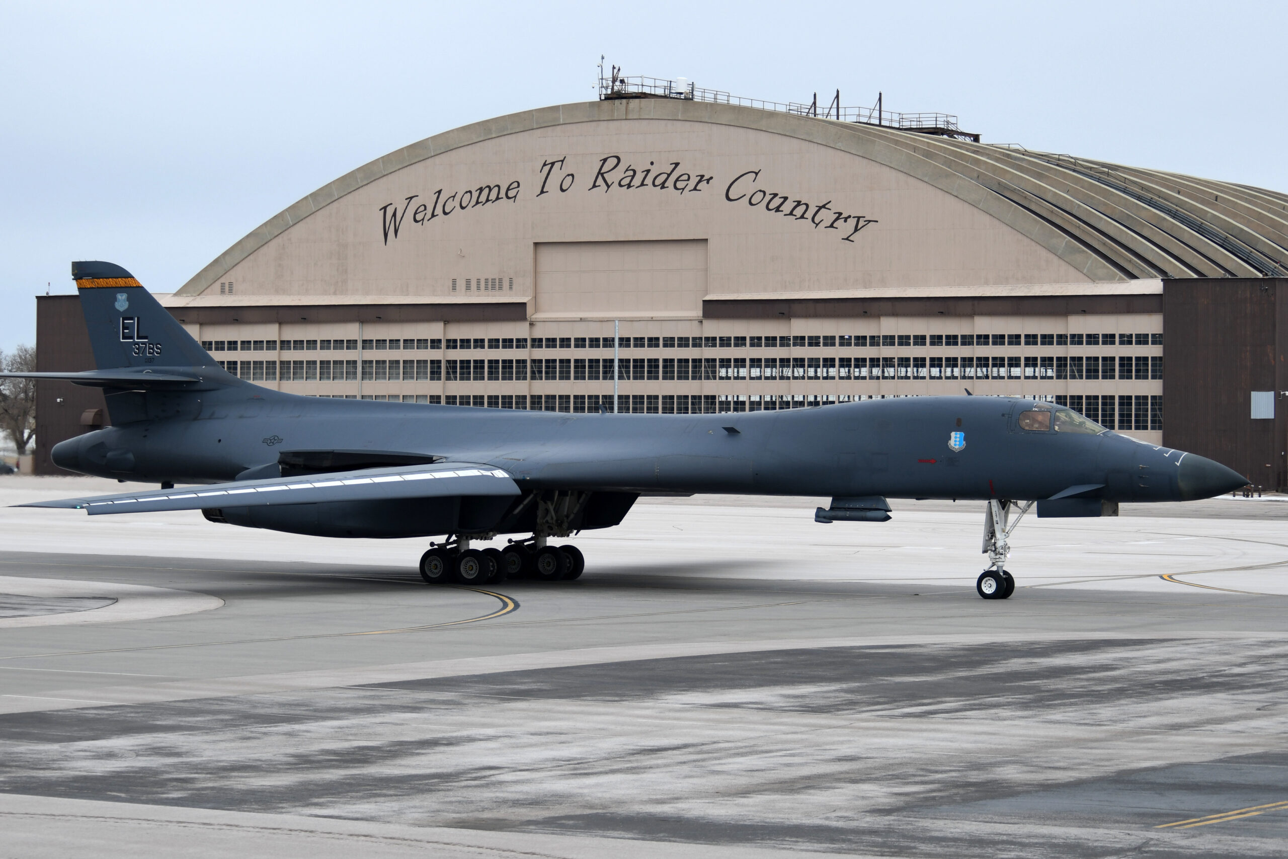 A B-1B Lancer assigned to the 28th Bomb Wing taxi’s past the PRIDE Hangar at Ellsworth Air Force Base, S.D., Jan. 22, 2020. The 37th Bomb Squadron is participating in Red Flag 20-1, where its mission is to maximize the combat readiness and survivability of participants by providing multi-domain training in a combined threat environment. (U.S. Air Force photo by Staff Sgt. Hailey Staker)